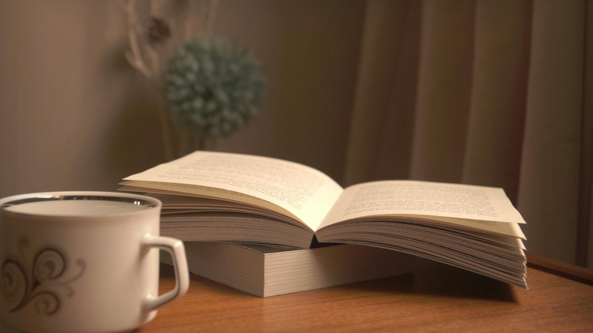 Open book and coffee cup on a table, representing trusted hormone health and BHRT patient education resources